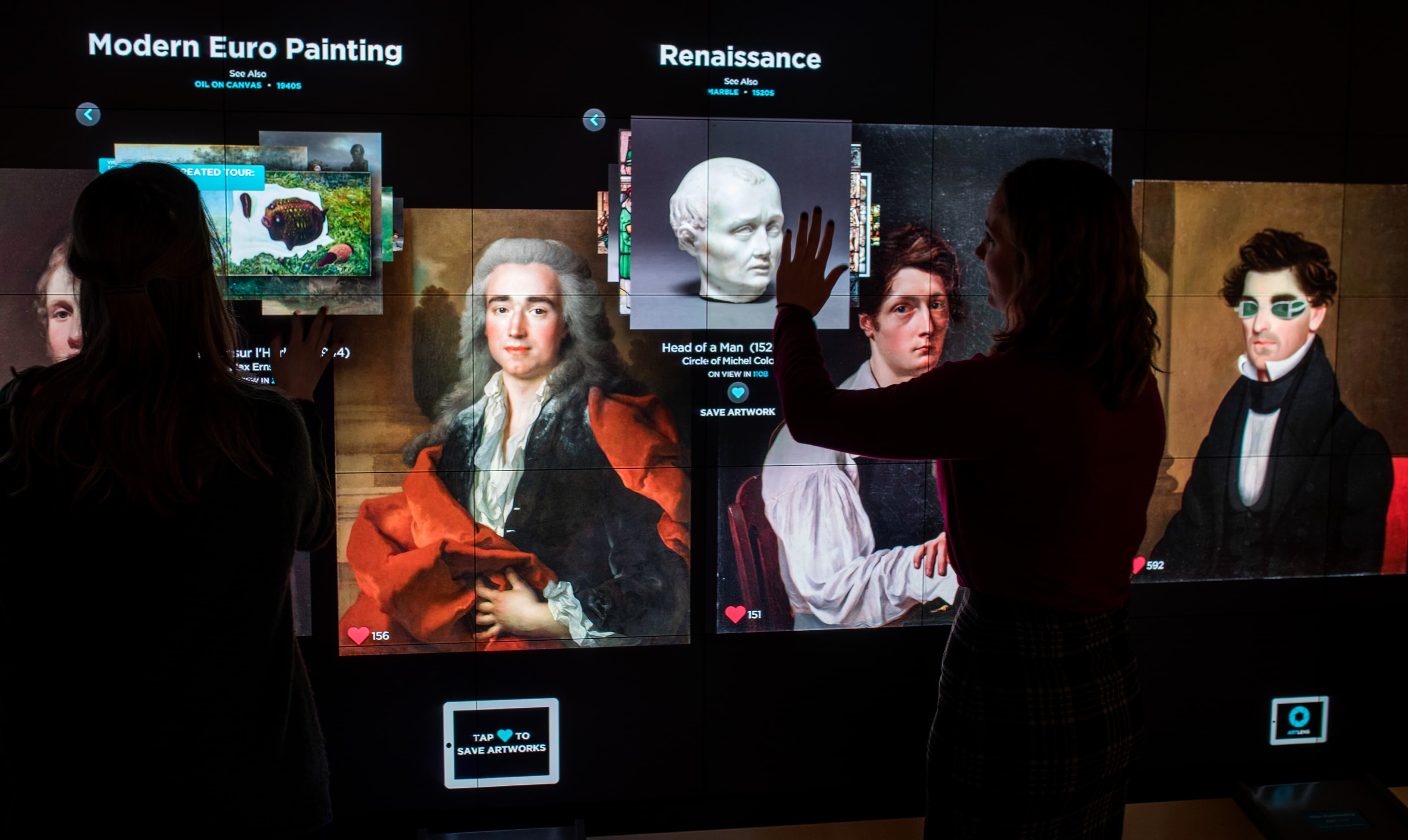 Visitors exploring renaissance art on the ArtLens Wall