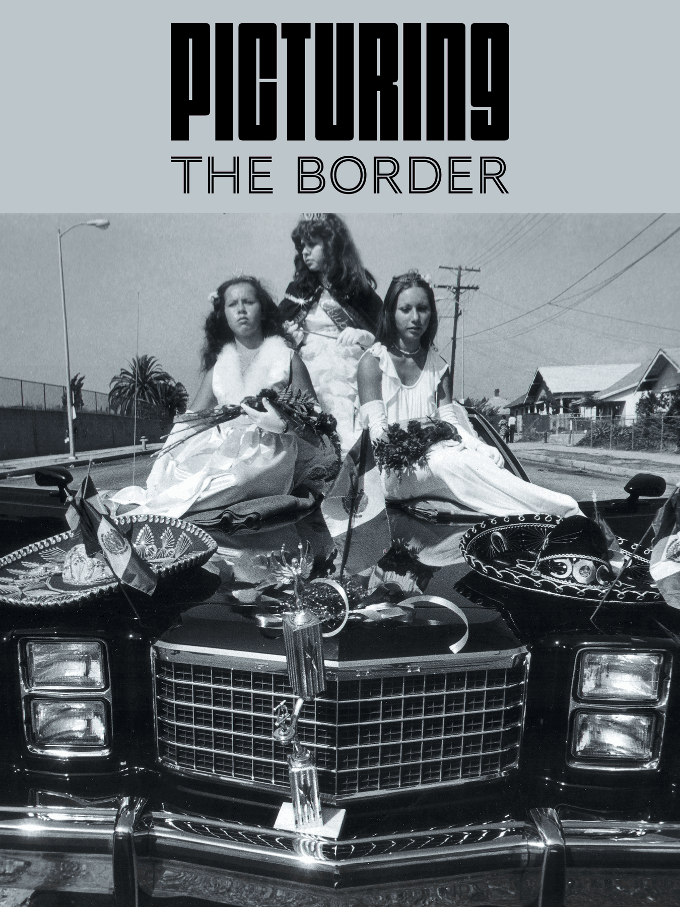 a group of women sitting on a car