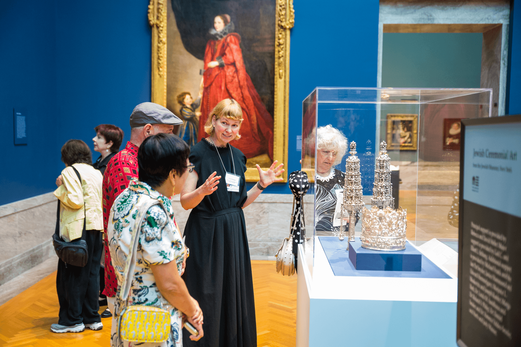 a group of people looking at art